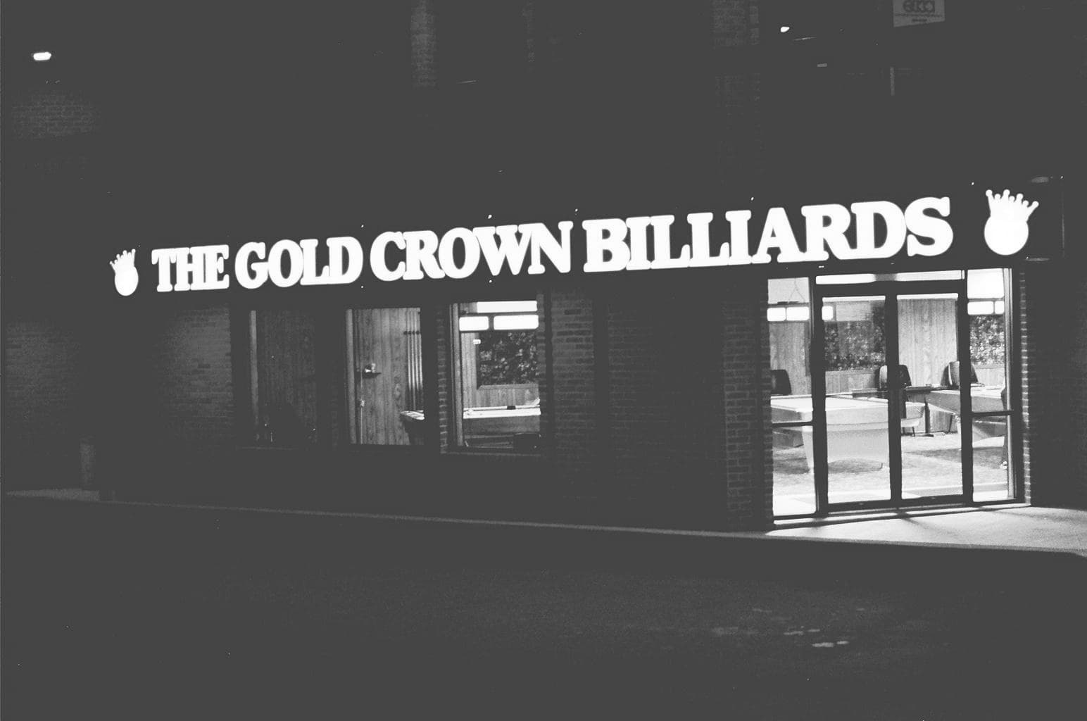 The Gold Crown Billiards storefront at night — the original signage