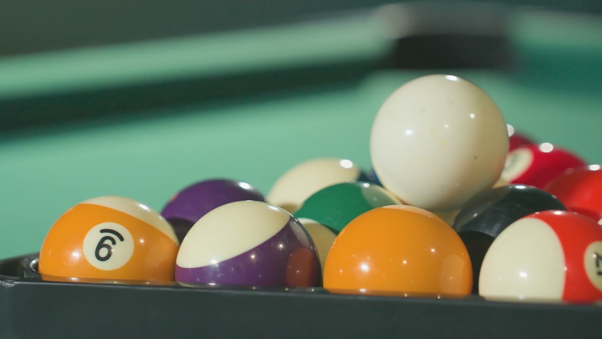Billiard balls racked on the felt