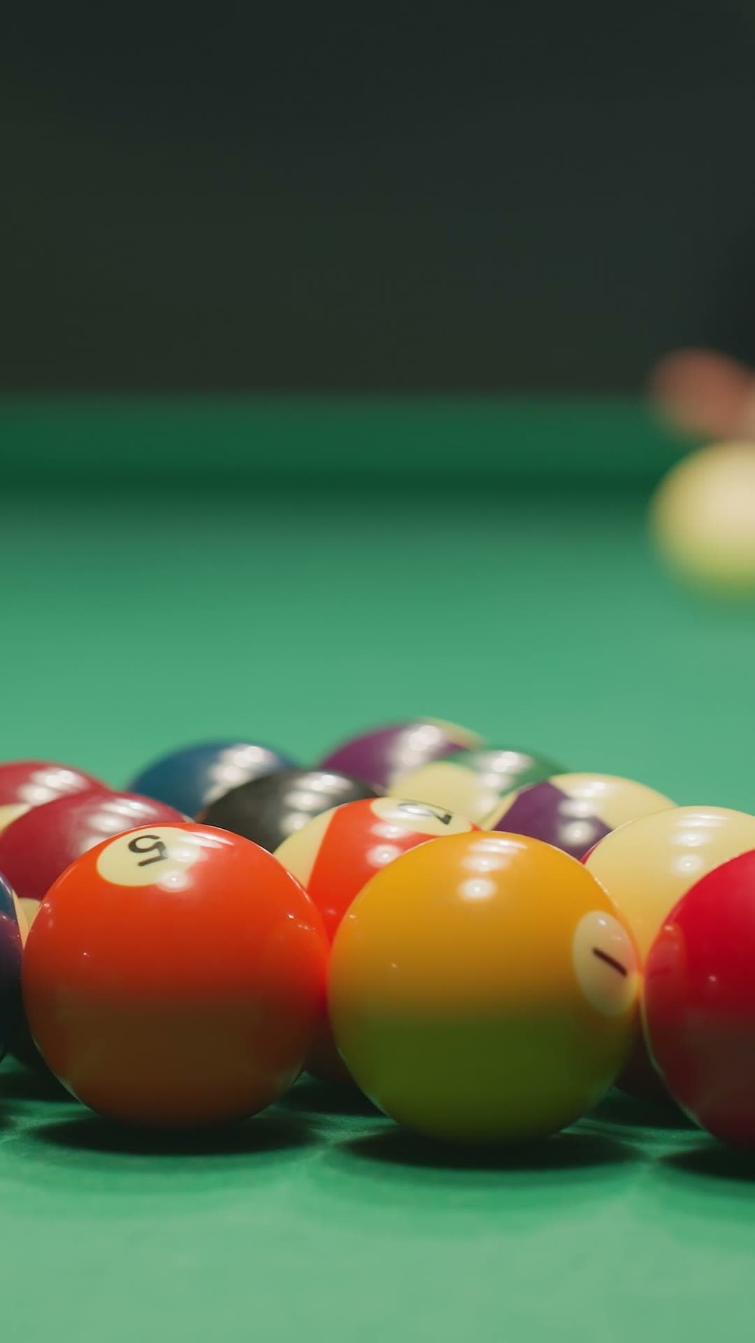 Player aiming shot on pool table